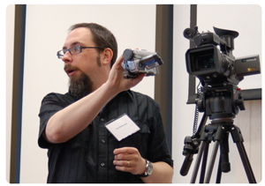 Paul Riismandel presenting a camera -- photo by Tanya Lee